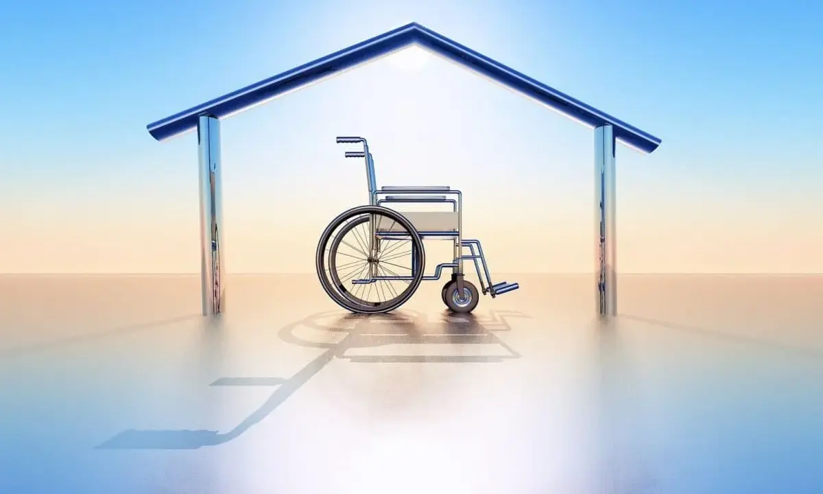 Fauteuil roulant sous un toit stylisé, symbolisant le logement PMR en location.