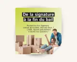 Un couple heureux entouré de cartons de déménagement. L'ADIL offre son aide aux locataires pour toutes leurs questions.