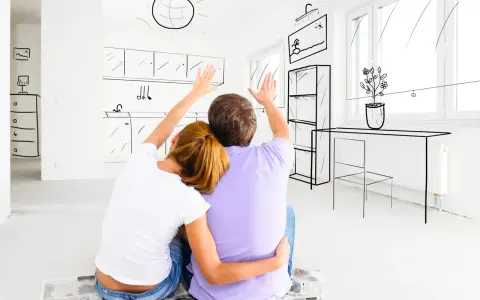 Un couple imagine sa future cuisine, se demandant : faut-il acheter DPE E ?