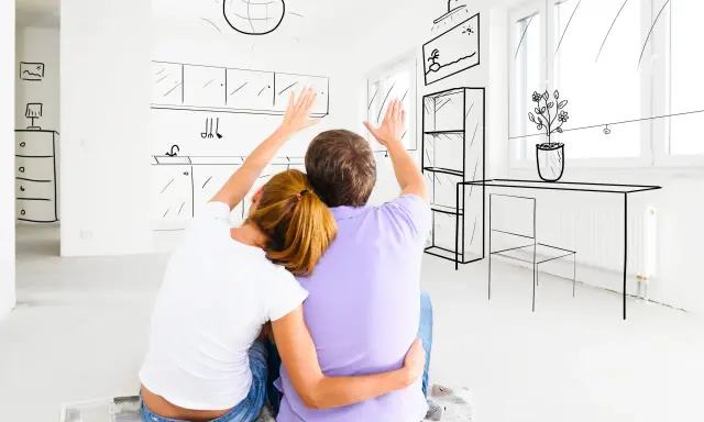 Un couple imagine sa future cuisine, se demandant : faut-il acheter DPE E ?