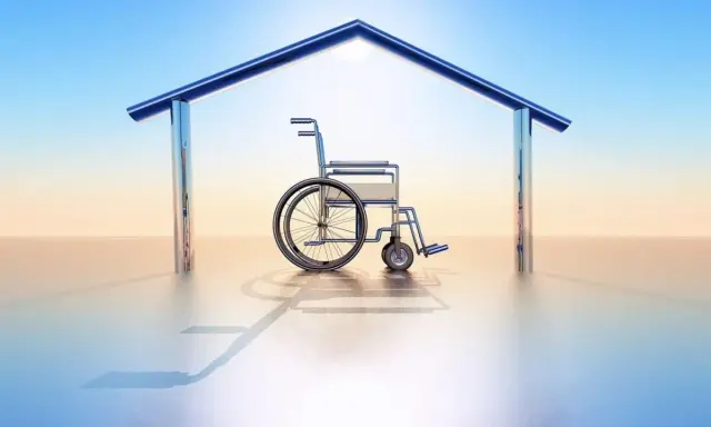 Fauteuil roulant sous un toit stylisé, symbolisant le logement PMR en location.